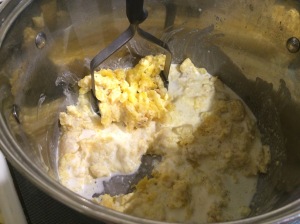 Add cream and butter to the potatoes, and MASH.